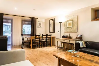 a living room with a couch and a table at House Maharac with 3 apartments till 15 persons in Kamno