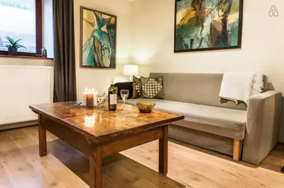 a living room with a couch and a table at House Maharac with 3 apartments till 15 persons in Kamno