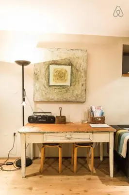 a desk in a room with a painting on the wall at House Maharac with 3 apartments till 15 persons in Kamno