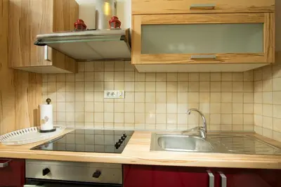 a kitchen with a sink and a counter top at Valentina Guest House at Pintar Wine Estate in Kojsko