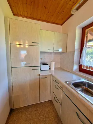 a kitchen with a sink and a refrigerator at Merlin in Renče