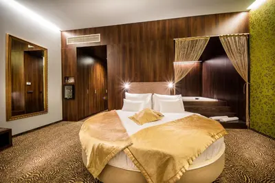 a bedroom with a large bed in a room at Rimske Terme Resort - Hotel Rimski dvor in Rimske Toplice