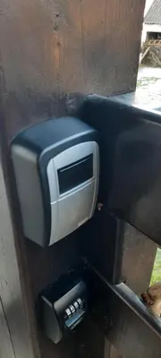 a soap dispenser on a wall with a microwave at View apartment Lenart in Bohinj