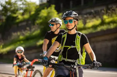 a group of people riding bikes down a road at Apartma Smithy (Kovačnica) in Laško