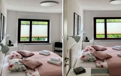 a bedroom with a large bed with pillows at Lanima in Bled