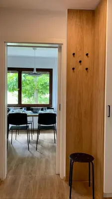 a dining room with a table and chairs and a window at Lanima in Bled