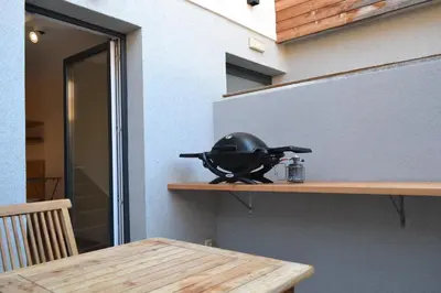 a helmet sitting on a shelf next to a table at APARTMA VODNIK in Bohinj