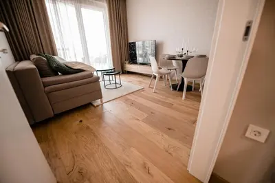 a living room with a couch and a table at Apartma 2+2 v mestu Ljubljana (V325) in Ljubljana