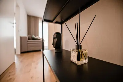 a room with a table with a vase on it at Apartma 2+2 v mestu Ljubljana (V325) in Ljubljana