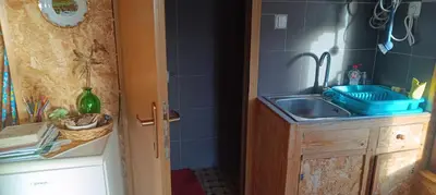 a small kitchen with a sink and a sink at Cowboy House at Ranch Lambergar in Gabrovka