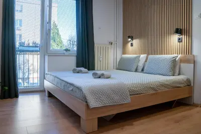 a bedroom with a bed with two towels on it at Small but cozy apartment in Maribor
