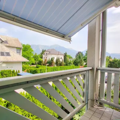 a balcony with a view of the mountains at Alpine Nest in Bled