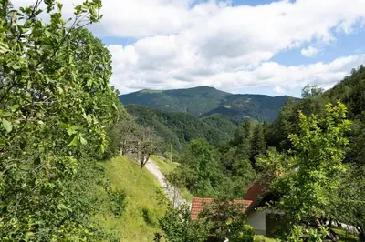 a view of a winding road in the mountains at At Peskar's a charming countryside house in Podbrdo