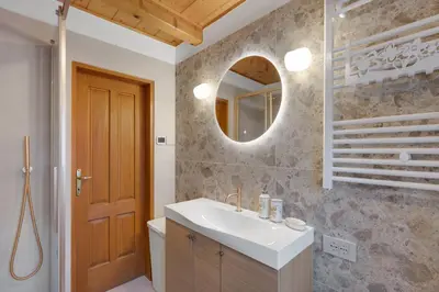 a bathroom with a sink and a mirror at Country House Lastovka in Tolmin