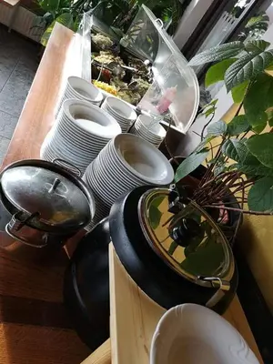 a bunch of plates and bowls on a table at Gostilna in apartmaji Zlati lev - Maribor in Maribor