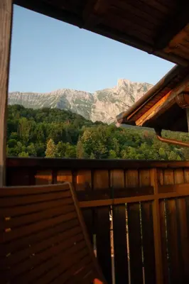 a window of a cabin with a view of a mountain at Apartma Burk in Kobarid