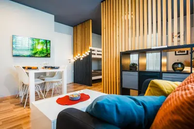 a living room with a couch and a table at Cosy apartment in Divača