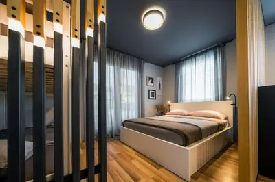 a bedroom with a bed and a window at Cosy apartment in Divača