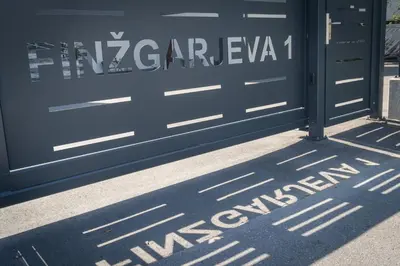 a blue garage door with the words vzzzzevaza written on at Cuckoo's Alpine Nest in Lesce