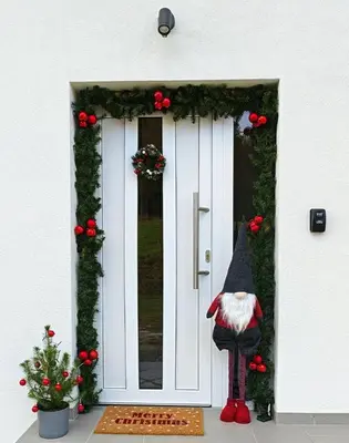 a door with a santa claus figure in front of it at Under The Castle in Dob