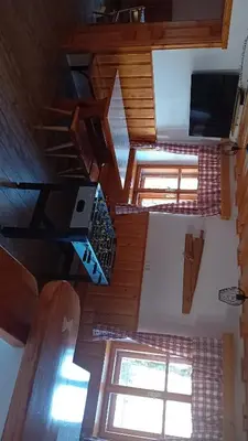 an overhead view of a room with wooden ceilings andwindows at Apartments Čumar in Cerkno