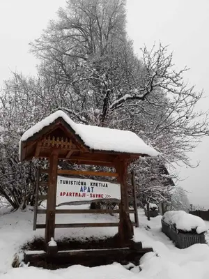 a sign with snow on top of it at Country House Apat in Šoštanj