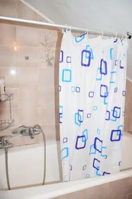 a shower curtain in a bathroom with a tub at Apartma narava in Begunje pri Cerknici