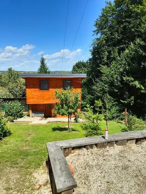 a house with a bench in front of it at Holiday Home Sveti Martin in Kobilje