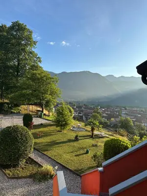 a view of a park with mountains in the background at Apartma pr' Gamilcu in Tolmin