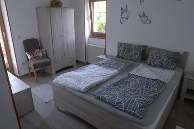 a bedroom with a bed in a room at Apartma pr' Gamilcu in Tolmin