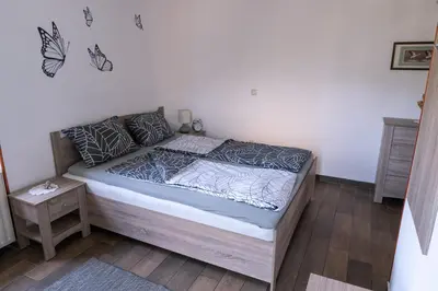 a bedroom with a bed in a room at Apartma pr' Gamilcu in Tolmin