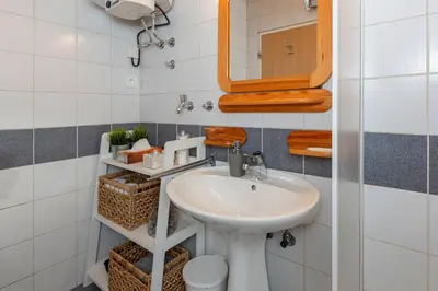 a bathroom with a sink and a mirror at Apartma Alpine Space, Kranjska Gora - Center in Kranjska Gora
