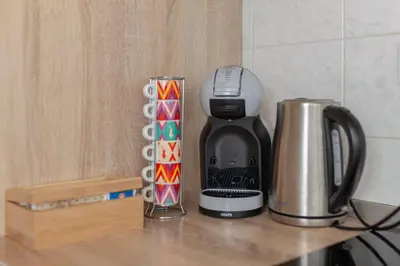 a coffee maker sitting on top of a counter at Apartma Alpine Space, Kranjska Gora - Center in Kranjska Gora