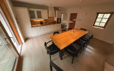 a dining room table and chairs in a kitchen at Old Taylor's house in Gradac