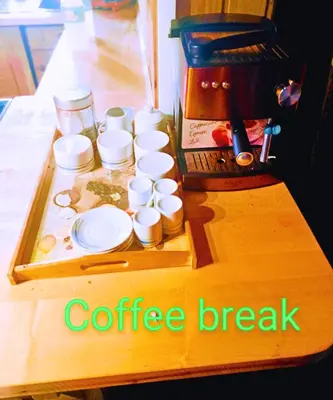 a coffee break table with coffee cups on it at Fairytale Wooden house by Ljubljana in Grosuplje