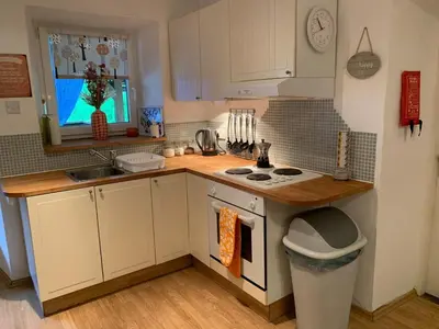 a small kitchen with a sink and a stove at Apartment Yiorgos in Bovec