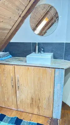 a bathroom with a sink and a mirror at Hisa Luciano for 5 near Bovec in Bovec