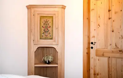 a room with a wooden cabinet with a plant on it at 2 Bedroom Stunning Apartment In Mozirje in Mozirje