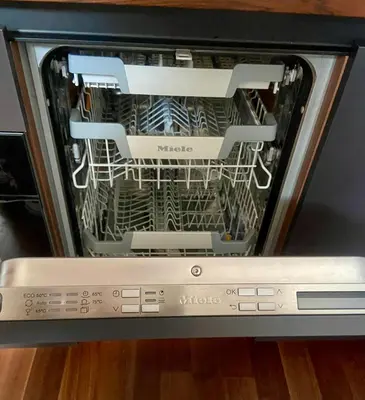 a dishwasher with its door open to show the dishes inside at Olimian Retreat Rosa 421 in Podčetrtek