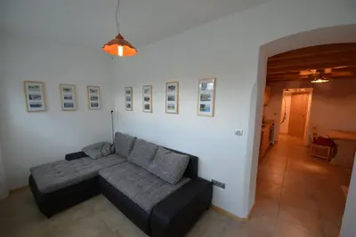 a living room with a couch in a room at Apartments Mojca in Bled