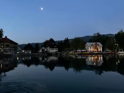 a large body of water with houses and buildings at Apartments Mojca in Bled