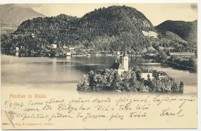 an old picture of a island in the middle of a lake at Apartments Mojca in Bled