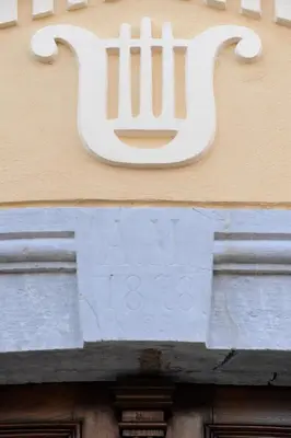 a white cat sign on the side of a building at B&B Castanea in Kostanjevica na Krki