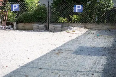 a shadow of a fence withp signs on it at Duplex Apartma Nikolina in Spodnje Jarše