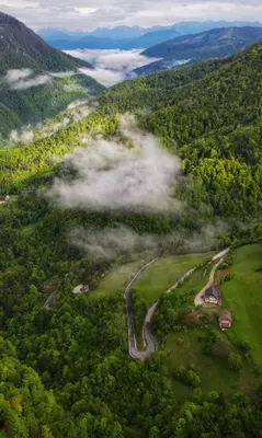 an aerial view of a golf course in the mountains at Guest House Kmečki Hram FORTUNA in Idrija
