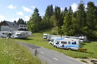 a group of rvs parked on the side of a road at Guest House Kmečki Hram FORTUNA in Idrija