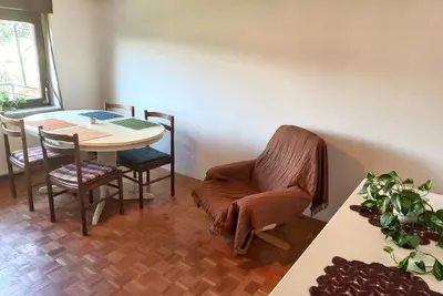 a dining room with a table and a chair and a table at Homestay Zajec in Grosuplje