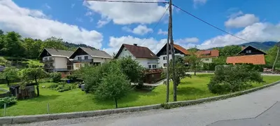 a group of houses on the side of a road at Apartma Bine in Bled