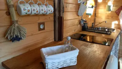 a kitchen counter with a sink and a basket on it at Pig barn - Svinjaki in Krasinec