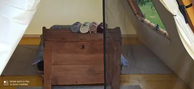 a pair of shoes sitting on top of a wooden dresser at Na vrtu K25 in Gradac